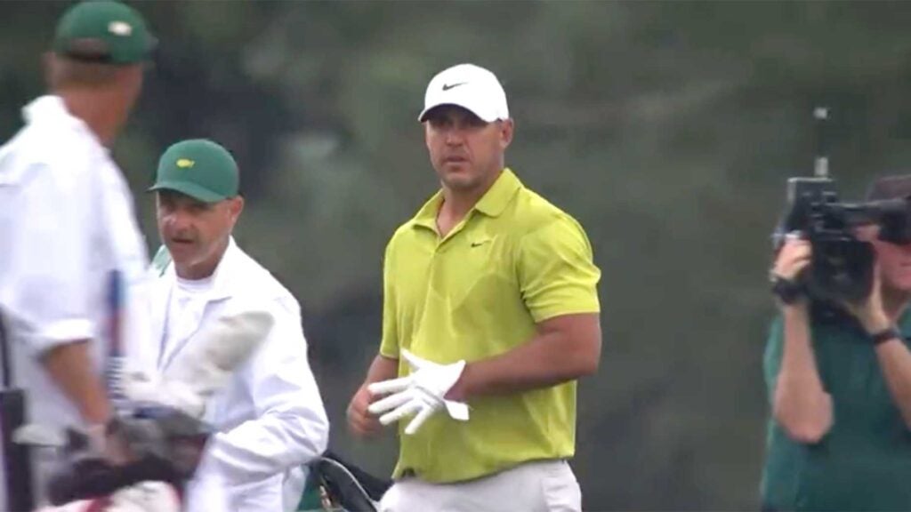 Brooks Koepka and his caddie on the 15th hole of the Masters on Thursday.