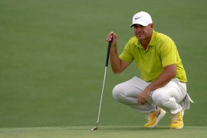 brooks koepka reads a putt on thursday at the masters