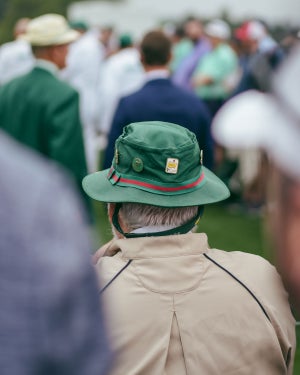 A patron in a Masters bucket hat