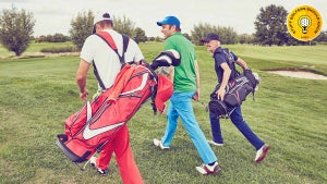 golfers walking down the fairway