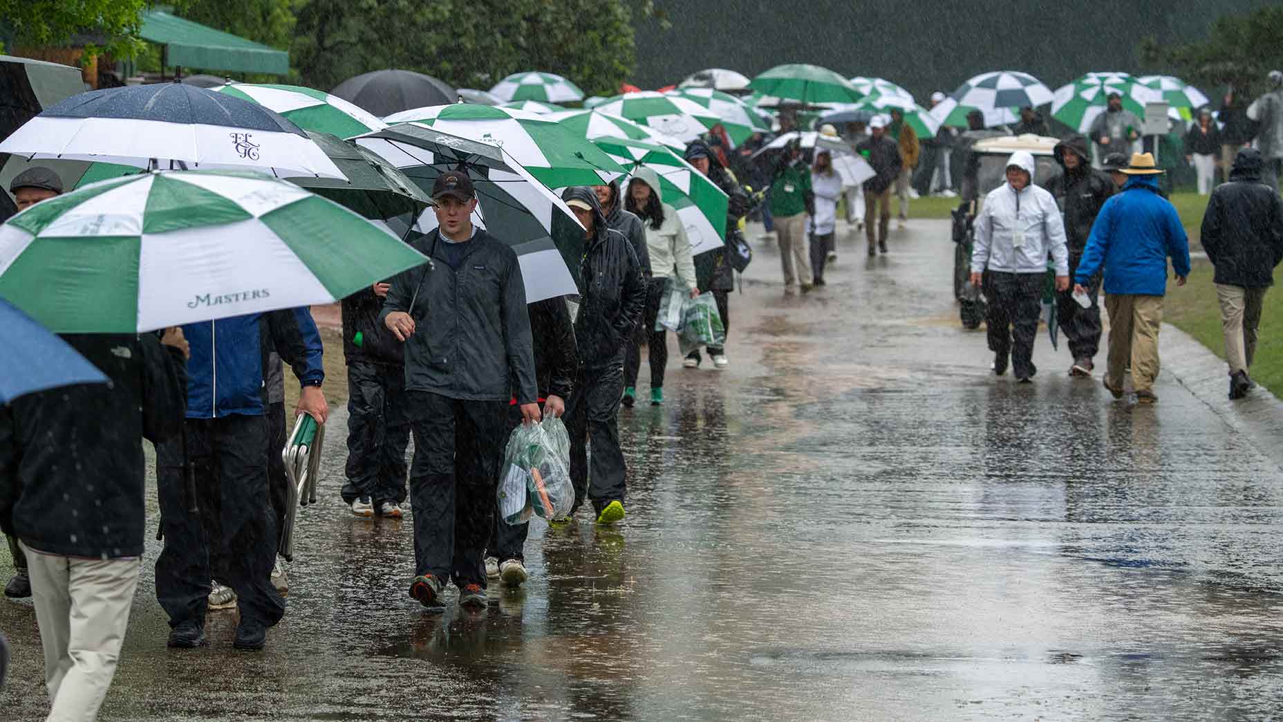 The Masters: Third round suspended as rain drenches field at