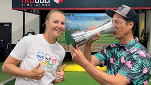 parker mclachlin drinks from trophy with anna nordqvist