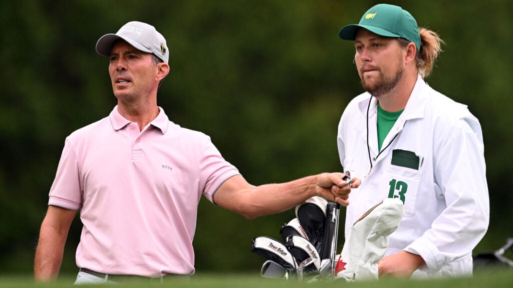 mike weir stands with his caddie