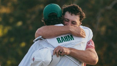 jon rahm hugs caddie masters