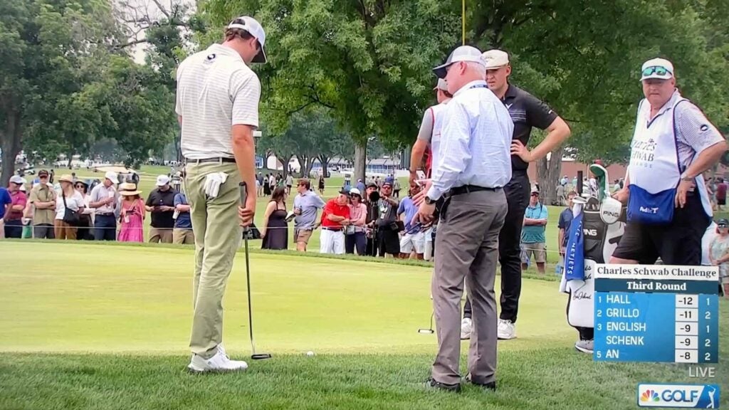 Tour contender left in odd scoring limbo after officials mull potential rules infraction