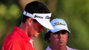Keegan Bradley (L) and Jason Dufner (R) wait on the first playoff hole during the final round of the 93rd PGA Championship at the Atlanta Athletic Club on August 14, 2011 in Johns Creek, Georgia