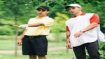 a golfer and caddie on the course