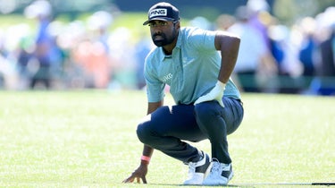 Sahith Theegala reads putt at 2023 Masters