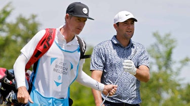 Scottie Scheffler walks with caddie at AT&T Byron Nelson