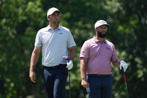 Scottie Scheffler of the United States and Jon Rahm of Spain look down the 18th fairway during the final round of the Memorial Tournament presented by Workday at Muirfield Village Golf Club on June 04, 2023 in Dublin, Ohio.