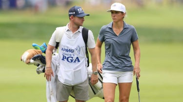 Mel Reid of England and her caddie walk the first fairway during the third round of the KPMG Women's PGA Championship at Baltusrol Golf Club on June 24, 2023 in Springfield, New Jersey.