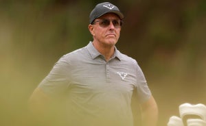 Phil Mickelson of the United States and his caddie Tim Mickelson on the seventh tee during the second round of the 123rd U.S. Open Championship at The Los Angeles Country Club on June 16, 2023 in Los Angeles, California.