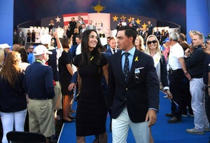 Rickie Fowler of the United States and fiance Allison Stokke depart the opening ceremony for the 2018 Ryder Cup at Le Golf National on September 27, 2018 in Paris, France.