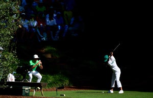Rickie Fowler's fiance Allison Stokke tees off during the Par 3 Contest for the Masters at Augusta National Golf Club, Wednesday, April 10, 2019.