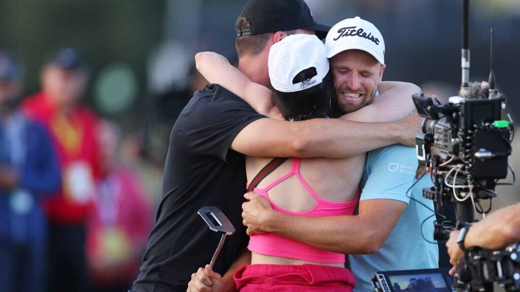 Wyndham Clark of the United States reacts to his winning putt with his family on the 18th green during the final round of the 123rd U.S. Open Championship at The Los Angeles Country Club on June 18, 2023 in Los Angeles, California.