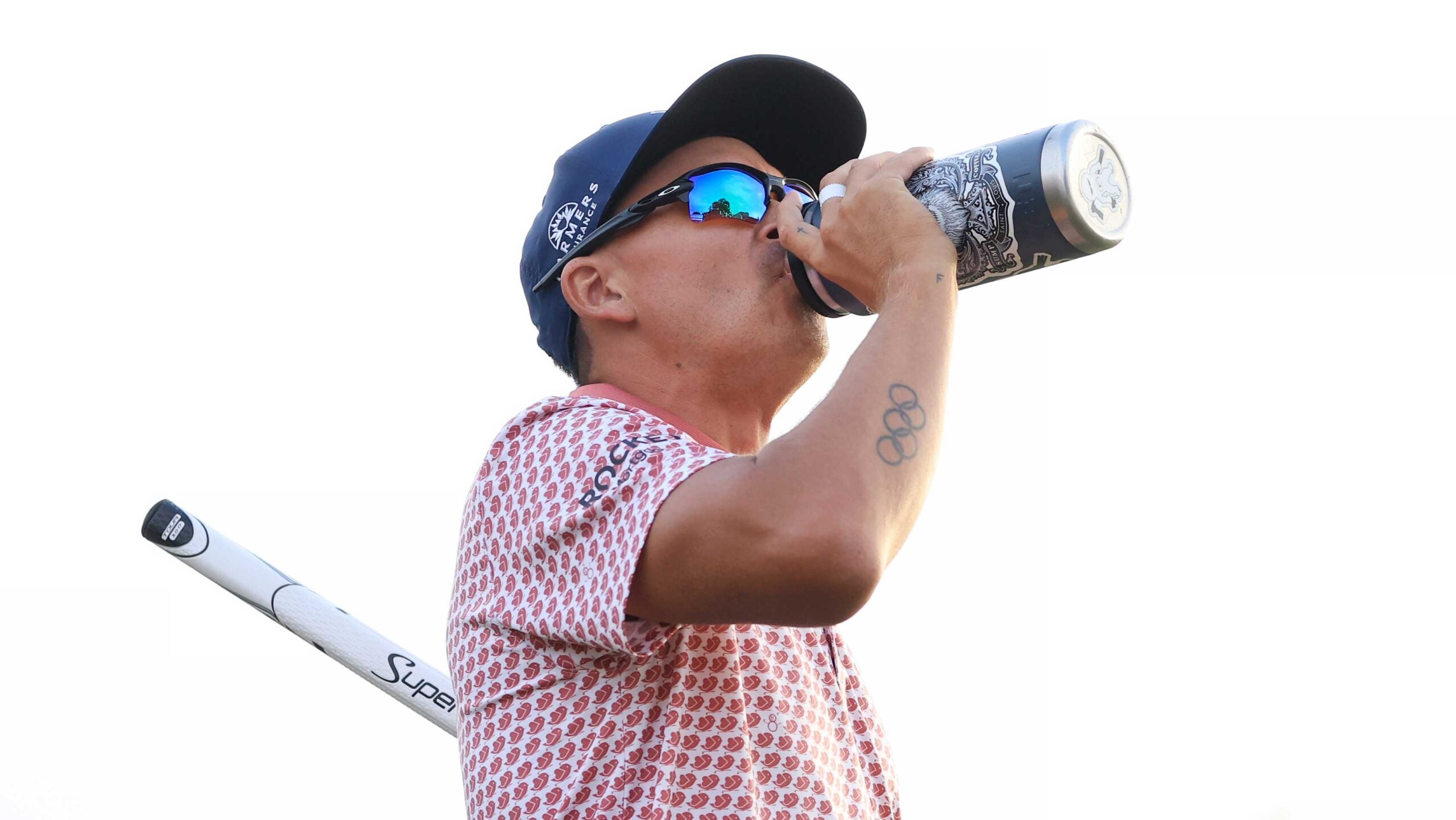 Stickers adorn Rickie Fowler's ever-present water bottle at US Open