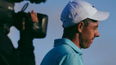rory mcilroy stands with camera