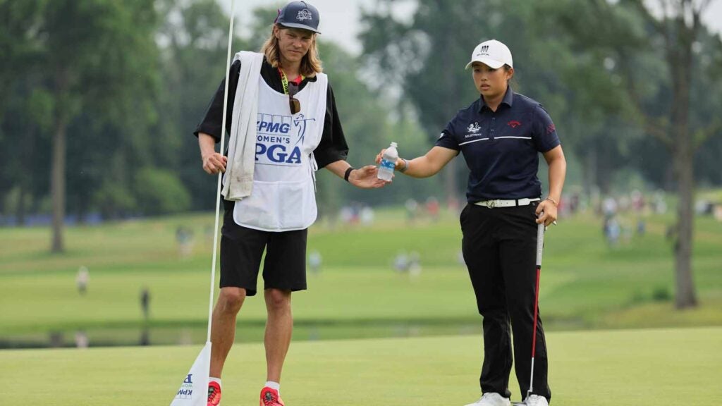 ruoning yin stands with her caddie