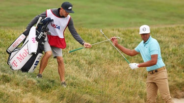 Tony Finau gets ready to play a shot from the bunker.