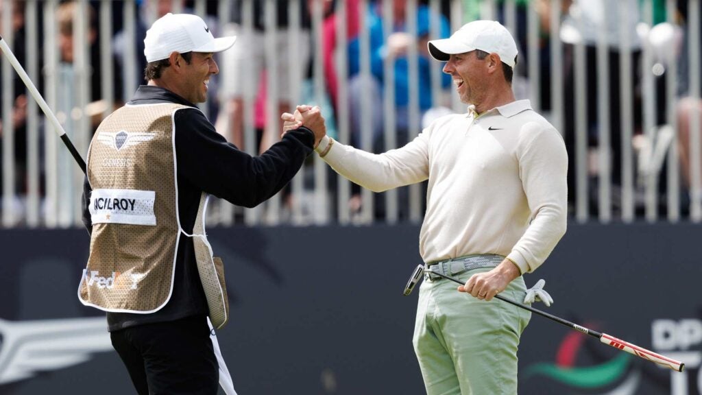 Rory McIlroy celebrates with caddie Harry Diamond (L) after winning the Genesis Scottish Open on day four of the Genesis Scottish Open at The Renaissance Club, on July 16, 2023, in North Berwick, Scotland.