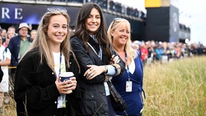 Matthew Jordan's girlfriend, Kate Parry (middle), and his mother look on at the first tee on Thursday at The Open.