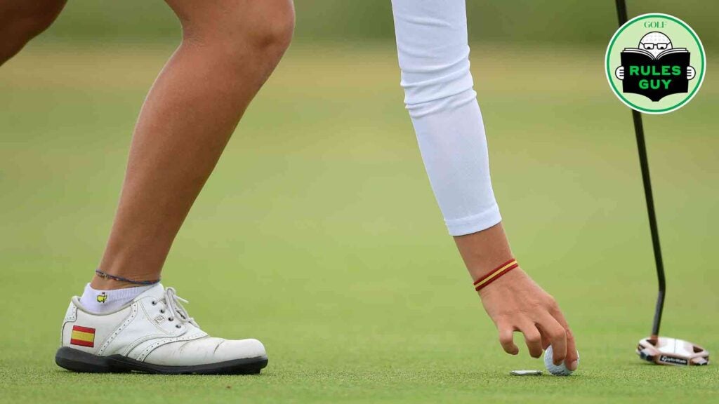 golfer marking ball