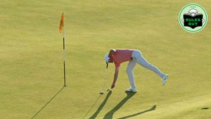 golfer marking ball