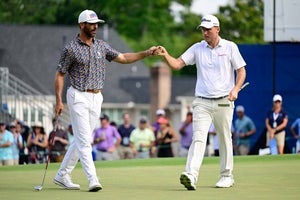 Russell Henley of the United States and Billy Horschel of the United States react on the 18th green during the third round of the Wyndham Championship at Sedgefield Country Club on August 05, 2023 in Greensboro, North Carolina.