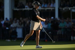 England's Charley Hull reacts after holing her par putt on the 18th green to take second-place on day 4 of the 2023 Women's British Open Golf Championship at Walton Heath Golf Club in Walton-on-the-Hill, south-west of London on August 13, 2023.