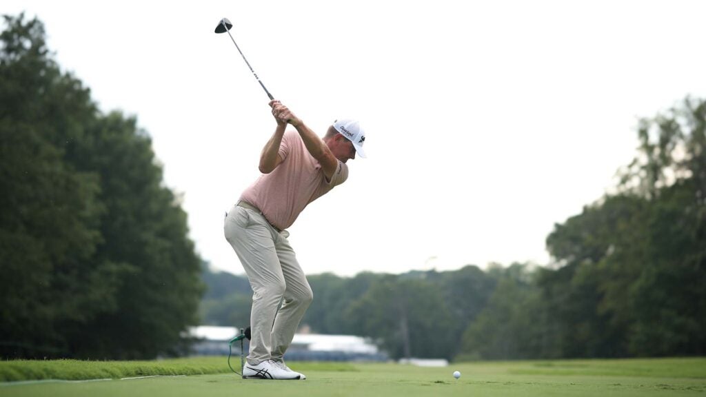 Lucas Glover of the United States plays his shot from the 18th tee during the third round of the Wyndham Championship at Sedgefield Country Club on August 05, 2023 in Greensboro, North Carolina.