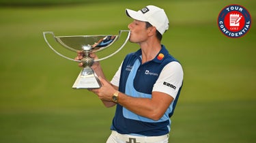 Viktor Hovland of Norway poses with the FedEx Cup Trophy after putting in to win on the 18th green during the final round of the TOUR Championship at East Lake Golf Club on August 27, 2023 in Atlanta, Georgia.