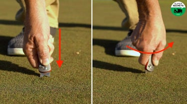 golfer repairing ball mark