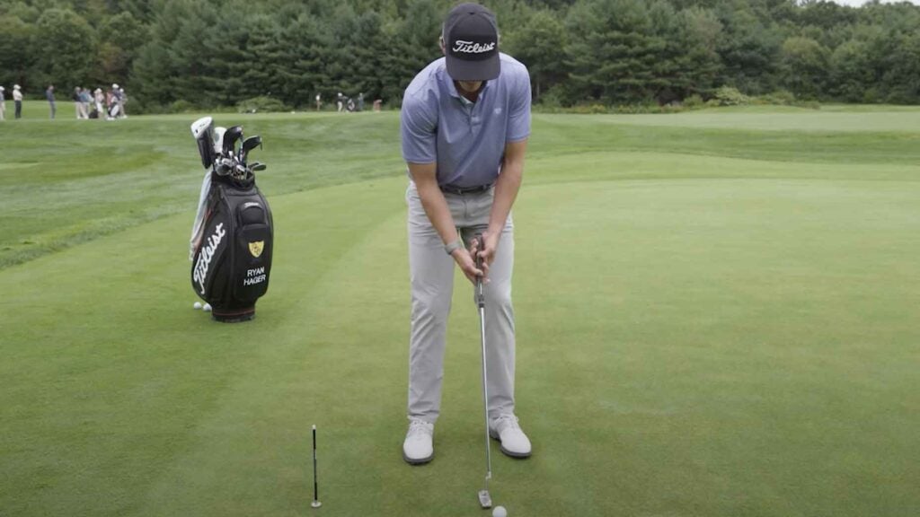 Titleist staff member Ryan Hager demonstrates how a simple long distance putting drill can help golfers improve their touch on the greens