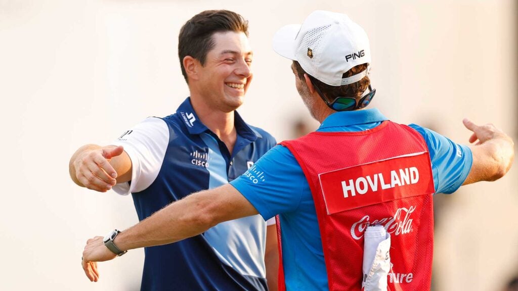 Viktor Hovland hugs his caddie and celebrates his Tour Championship victory on Sunday.