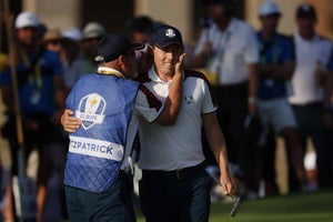 Matt Fitzpatrick of Team Europe is congratulated by his caddie, Billy Foster during the Saturday afternoon fourball matches of the 2023 Ryder Cup at Marco Simone Golf Club on September 30, 2023 in Rome, Italy.