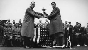 In Leeds, British golfer George Duncan (1883 - 1964) captain of the British Ryder Cup team is presented with the cup by British businessman Samuel Ryder (1859-1936), founder of the Ryder Golf Cup.