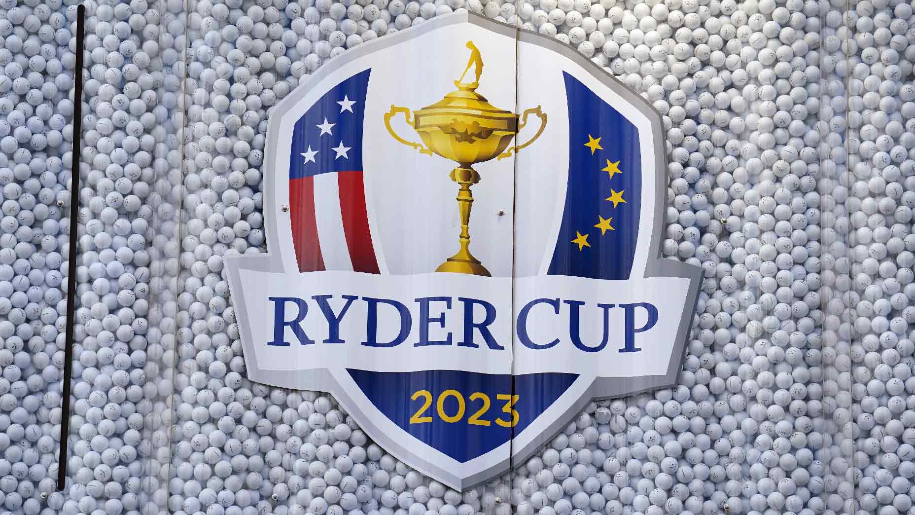 The 2023 Ryder Cup logo in front of golf balls