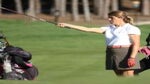 woman golfer aiming