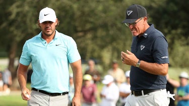 phil mickelson and brooks koepka stand next to one another at LIV miami.