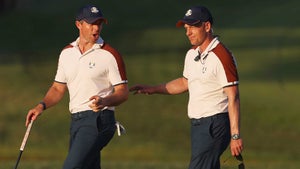 Rory McIlroy and European captain Luke Donald walk and talk during the 2023 Ryder Cup in Rome