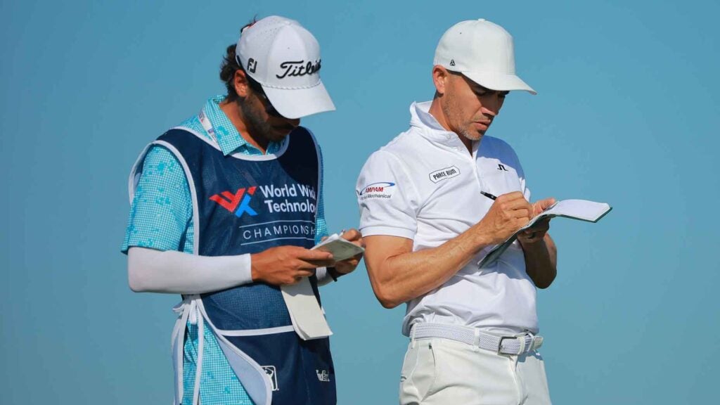 Camilo Villegas studies his yardage book at the World Wide Technologies Championship