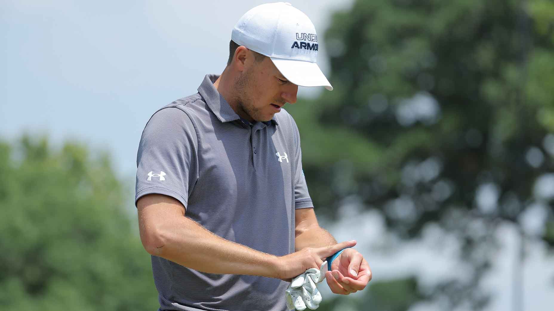 Jordan Spieth checks on his injured left wrist prior to the Charles Schwab Challenge at Colonial Country Club on May 24, 2023 in Fort Worth, Texas