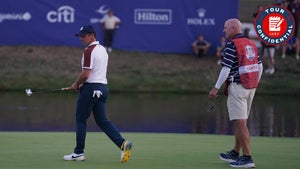 Rory McIlroy walking away from Joe LaCava at the 2023 Ryder Cup