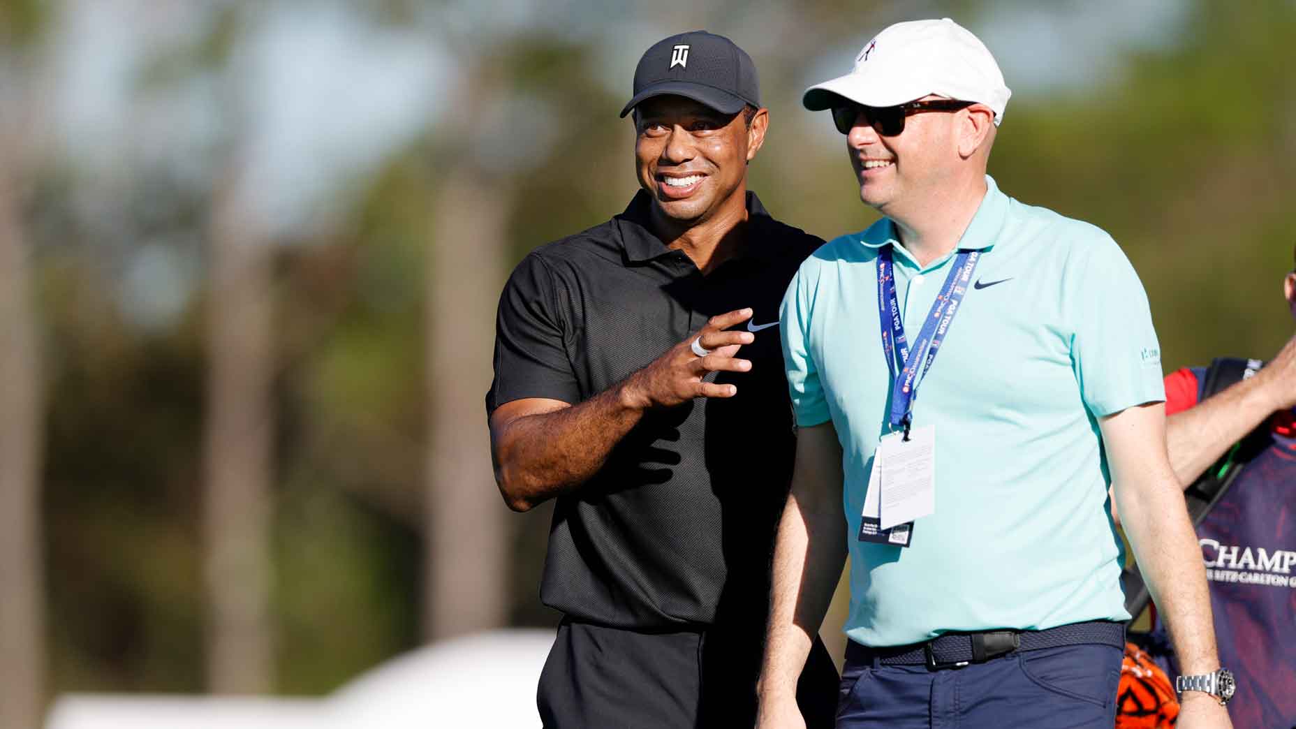 Tiger Woods of the United States and Rob McNamara, Executive Vice President at TGR, look on during the Pro-Am ahead of the PNC Championship at the Ritz Carlton Golf Club Grande Lakes on December 17, 2021 in Orlando, Florida.