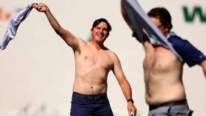 joel dahmen and harry higgs take off their shirts in celebration at the 2022 WM Phoenix Open