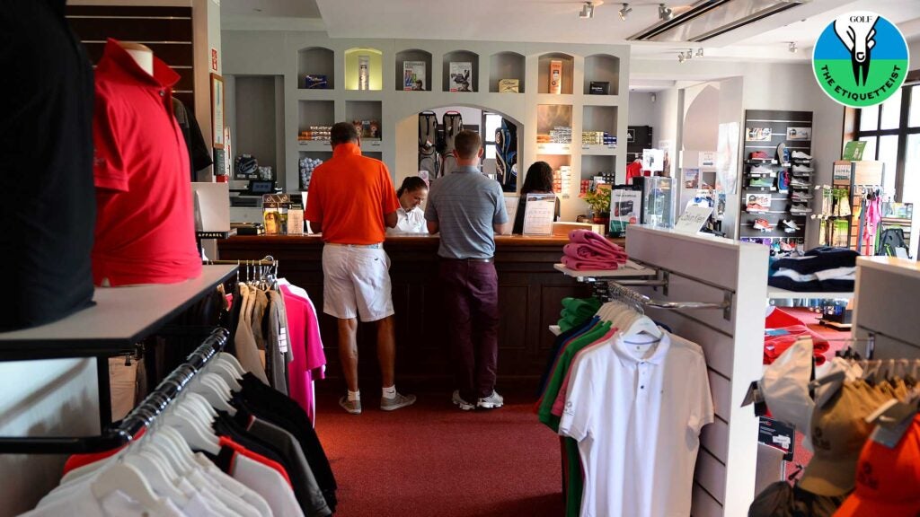 Golfers talk to the pro shop worker at a golf course.