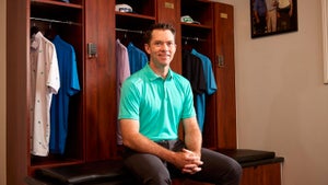 Ping Vice President of Fitting and Performance Marty Jertson poses in front of golf lockers