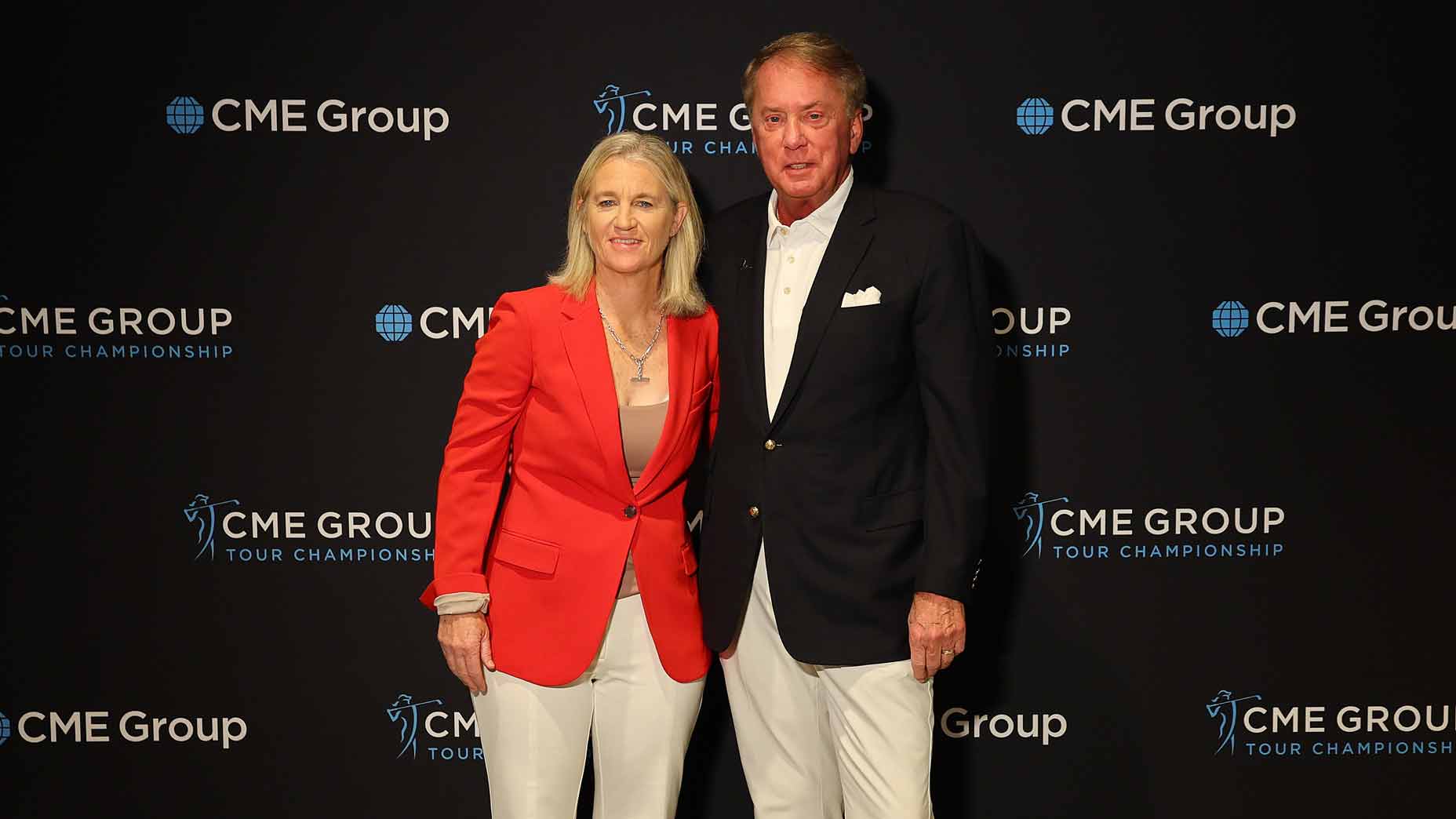 molly marcoux samaan and terry duffy pose for photo at the cme group tour championship