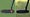 Split image of wo odyssey ai-one putters on a golf course