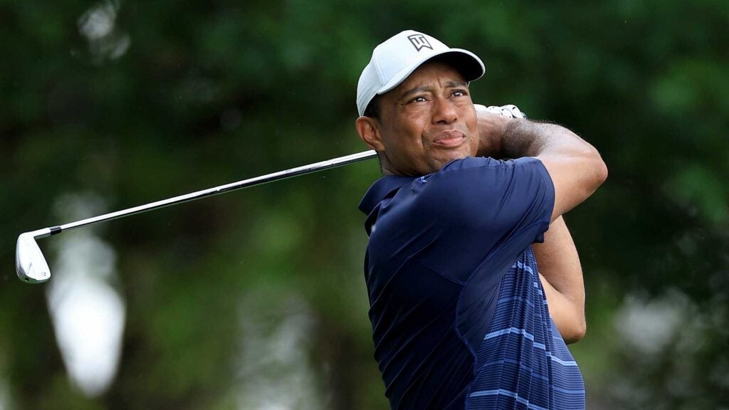 Tiger Woods hits iron shot during 2023 Masters at Augusta National